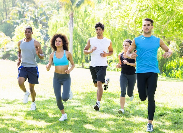 Premium Photo | People running together in park