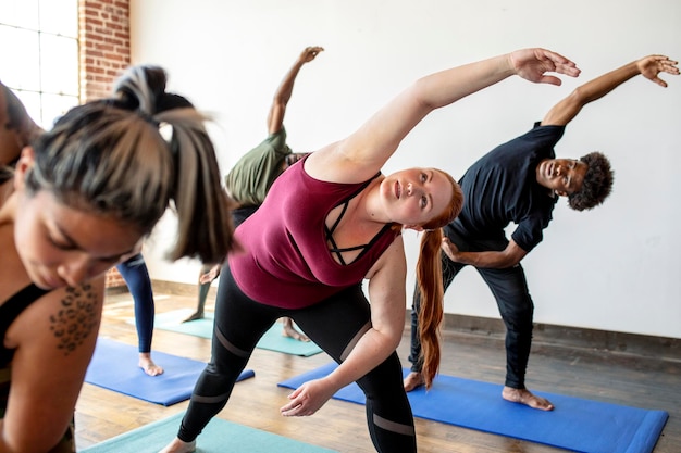 Premium Photo | People stretching in a yoga studio