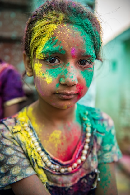 Premium Photo | People throw colors to each other during the holi ...