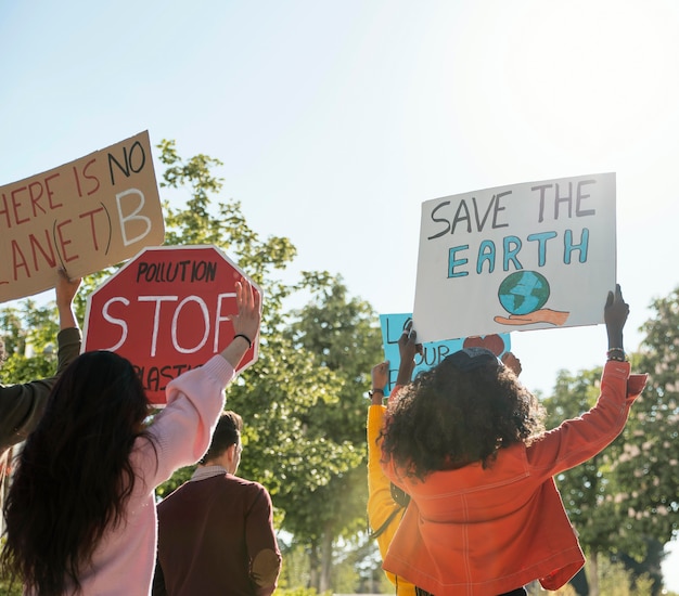 Premium Photo | People with placards protesting to save planet