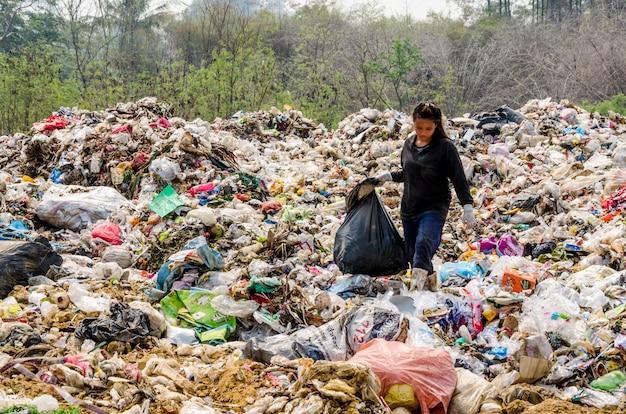 Premium Photo | People working in municipal waste disposal open dump ...