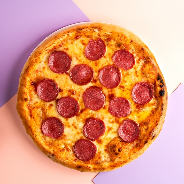 Free Photo Pepperoni Pizza With Salami And Cheese On Table