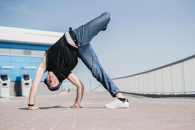 Premium Photo | A person perfoming breakdance in the street outdoors ...
