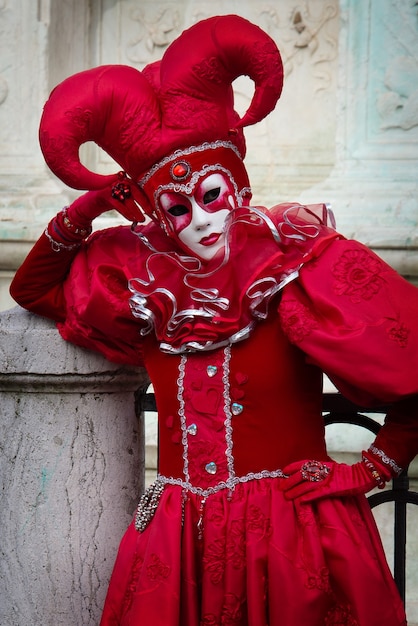 Premium Photo Person In Red Carnival Costume Of Harlequin Italian Commedia Dell Arte Theatre