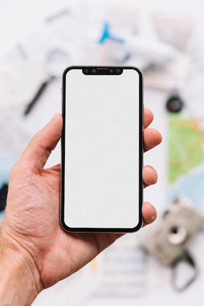 A person showing blank white screen display on smartphone Photo | Free