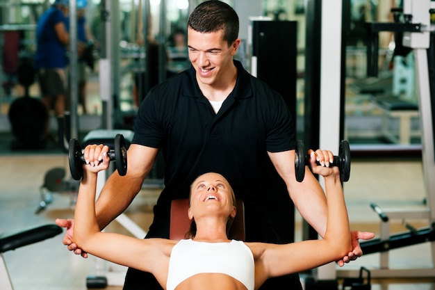 Premium Photo | Personal trainer in gym