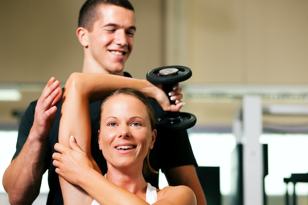 Premium Photo | Personal trainer in gym