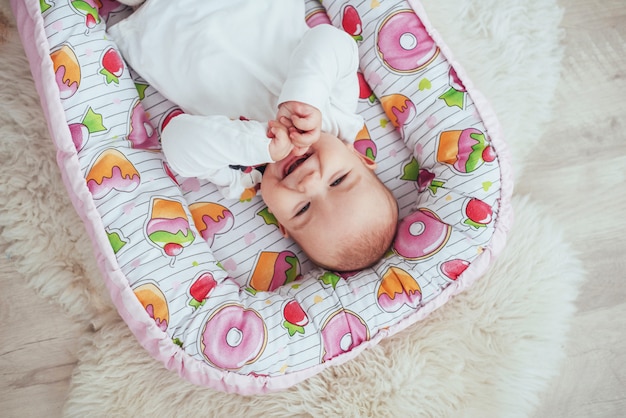 Premium Photo Photo Charming Newborn Baby In A Pink Cradle