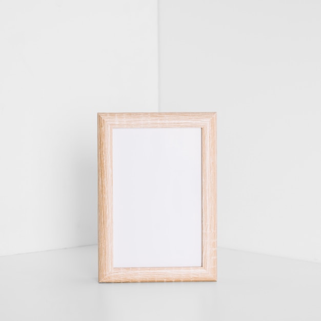 Free Photo | Photo frame in corner of room