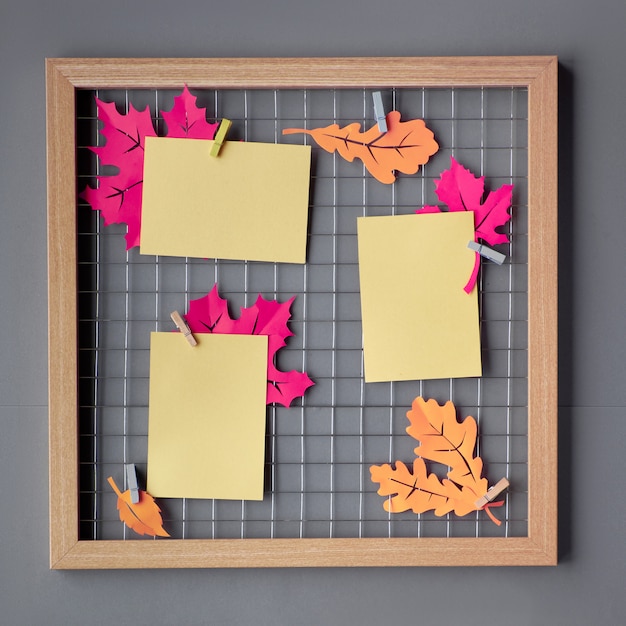 Photo grid board with purple paper autumn leaves, mockup for your pictures or lettering Premium Phot