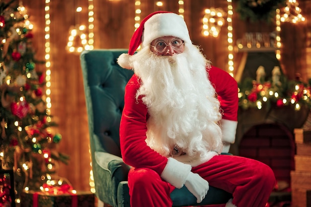 Premium Photo | Photo of happy santa claus in eyeglasses looking at camera