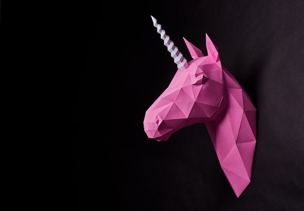 Premium Photo | Photo of pink origami unicorn's head.