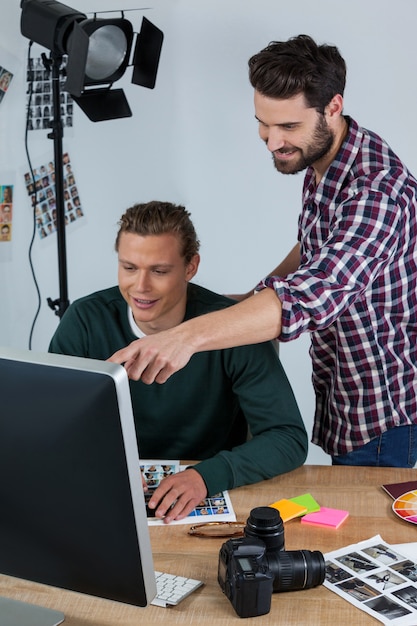 Premium Photo Photographers Working At Desk