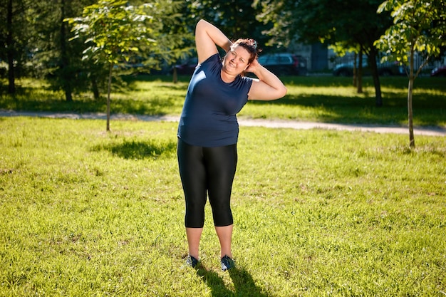 Premium Photo Physical Training Of Fat Femme On Nature Ground