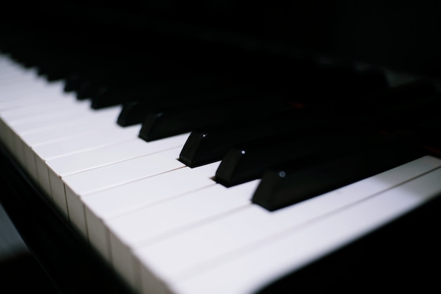 Piano keyboard background with selective focus. Premium Photo