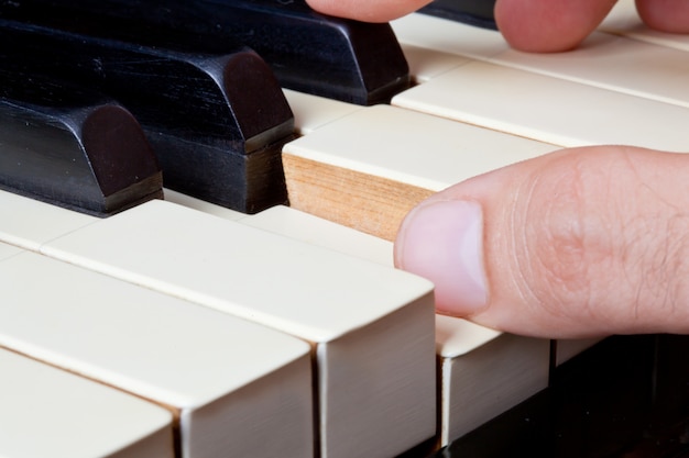 premium-photo-piano-keyboard-made-of-ivory-with-hands