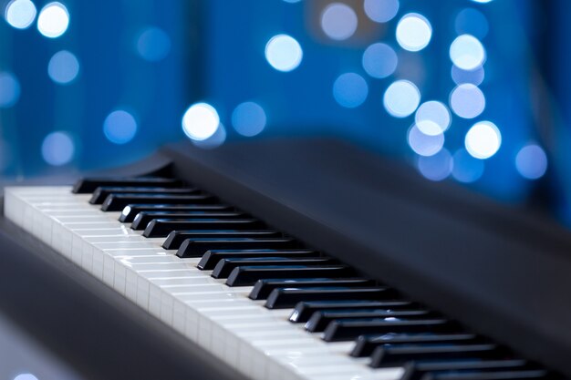 Premium Photo | Piano keys on a blue bokeh