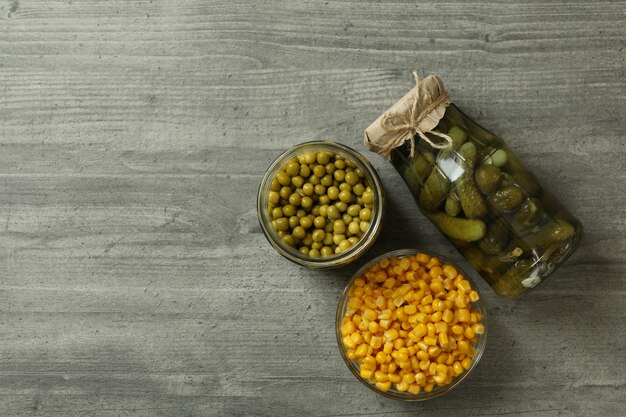  Pickled cucumbers, corn and peas on gray Premium Photo