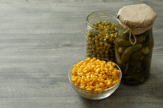  Pickled cucumbers, corn and peas on gray Premium Photo