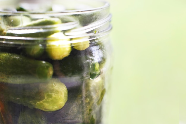 Premium Photo | Pickled cucumbers in a glass jar. gherkins cucumbers on