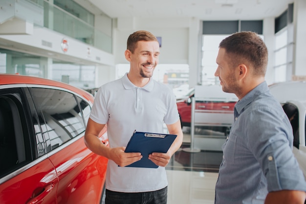 Premium Photo | Picture of customer and seller stand together in front ...