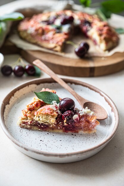 Premium Photo Piece Of Open Pie Or Galette With Cherry Almond And Ice