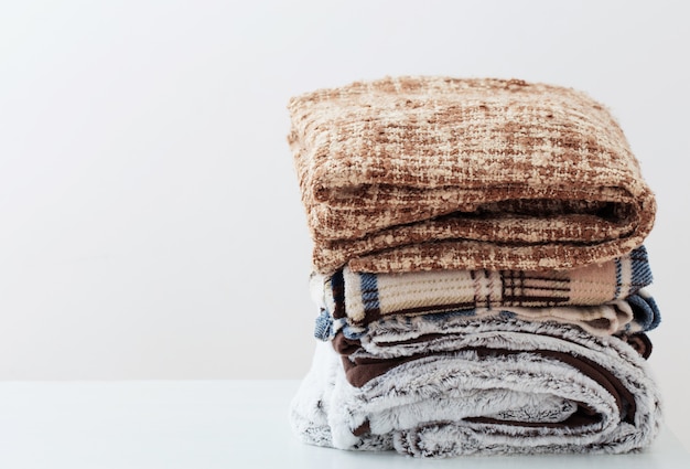 Premium Photo | Pile of blankets on a white space