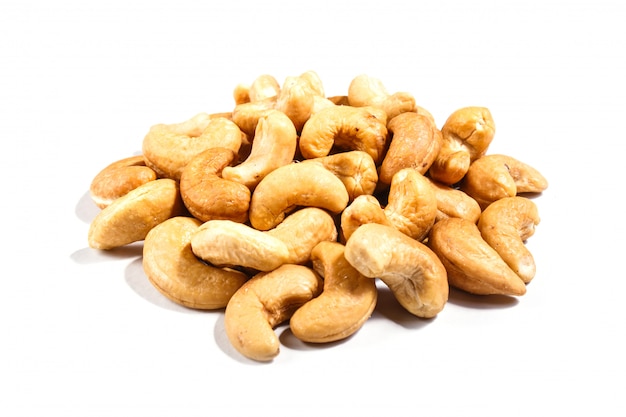 Premium Photo | Pile of cashew nuts isolated on white background.