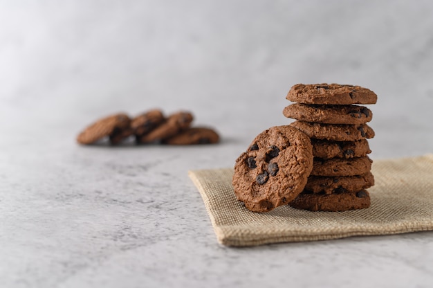 A pile of cookies on a cloth on a wooden table Free Photo