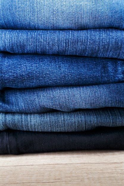 Pile of denim pants Photo | Premium Download