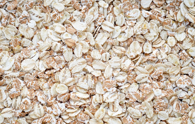 Premium Photo | Pile of oat-flakes, background of uncooked oats. raw ...