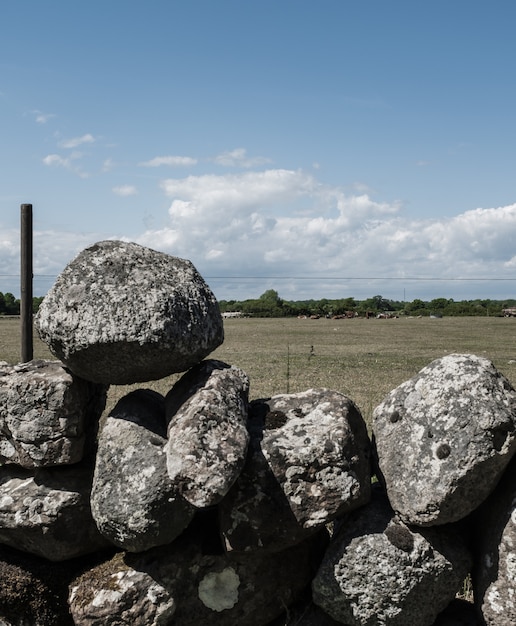 free-photo-pile-of-rocks-stacked-on-top-of-each-other-as-a-fence-in-a