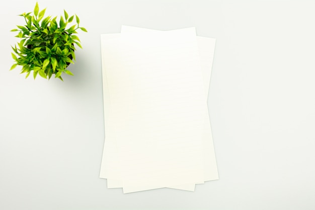 Piles Of Paper On The White Desk Background With A Copy Space