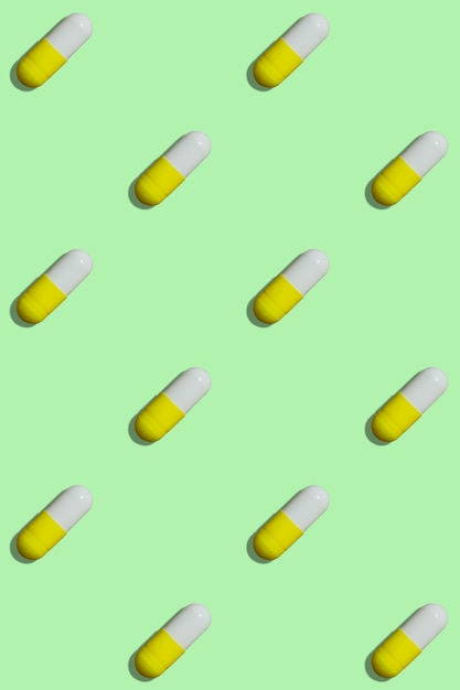 Premium Photo | Pill pattern on green background