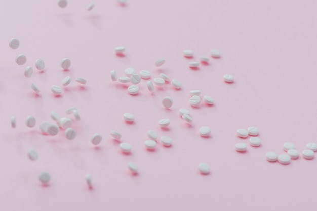 Free Photo | Pills on pink background