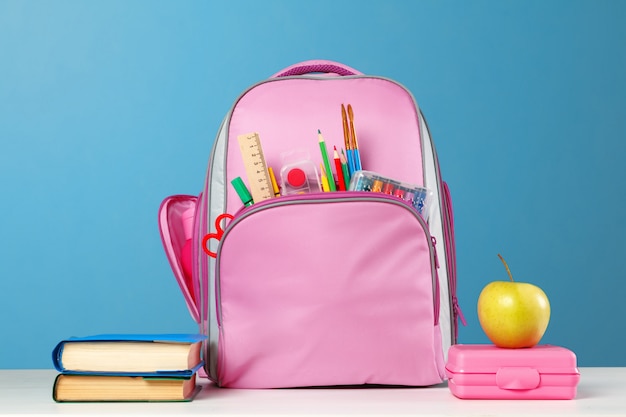 Premium Photo | Pink backpack with stationery objects