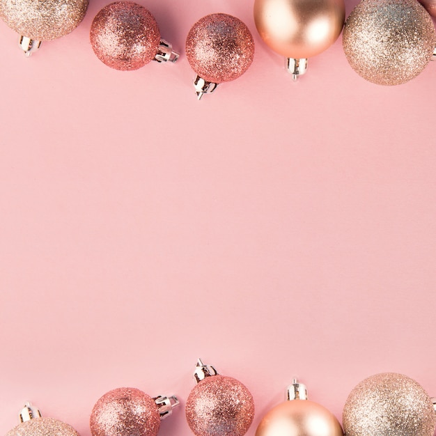 Pink baubles in row on pink Photo | Free Download