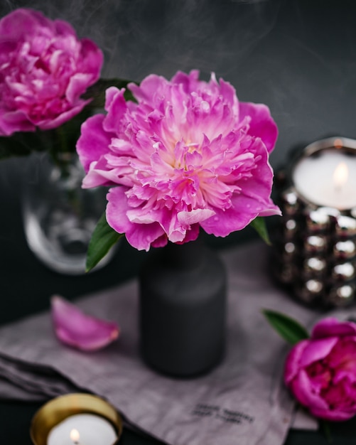 Premium Photo | Pink blooming peony flower bud in a gray vase with ...