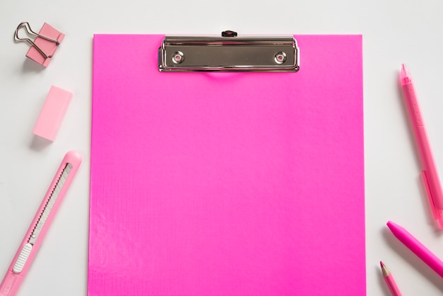 Free Photo | Pink clipboard and basic stationery