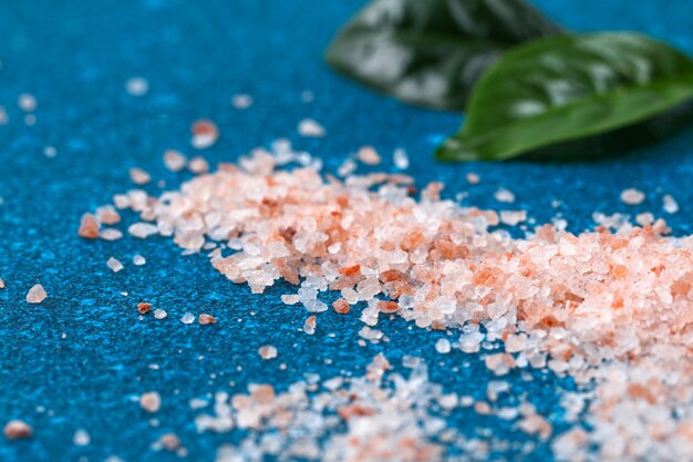 Premium Photo Pink Coarse Salt Crystals On Blue Table