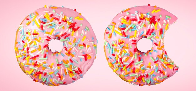 Premium Photo | Pink donut with colorful sprinkles isolated on pink