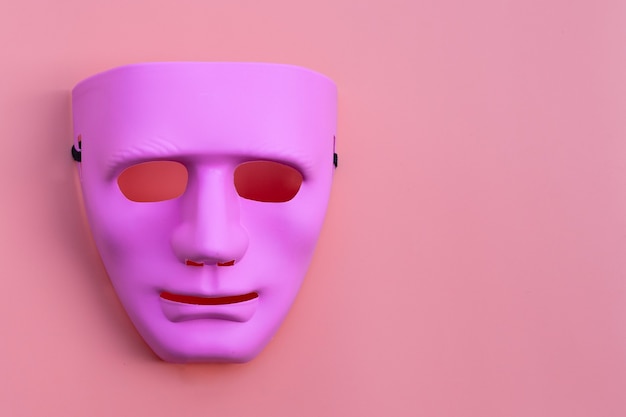 Premium Photo  Pink face mask on pink surface. copy space