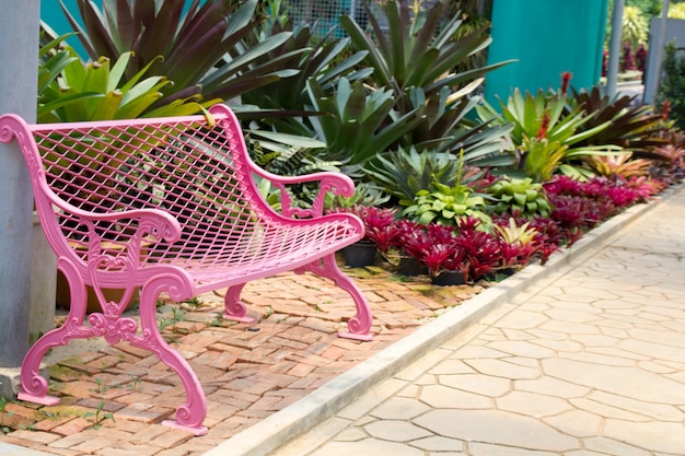 Premium Photo | Pink garden chair in the garden.