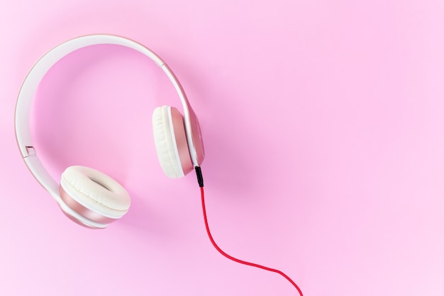 Premium Photo | Pink headphone and red cable on pastel color pink ...