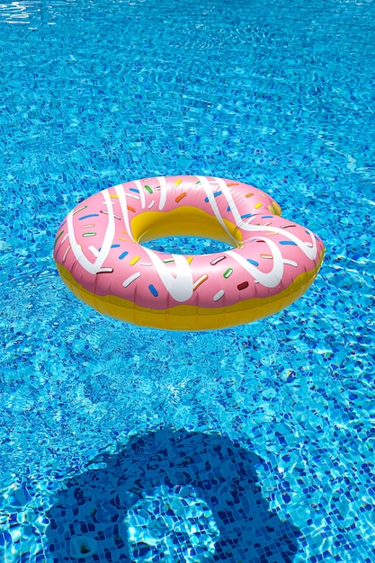 Premium Photo | Pink inflatable donut doughnut in swimming pool