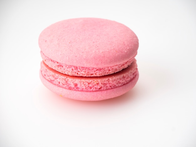 Premium Photo | Pink macaroon on white background