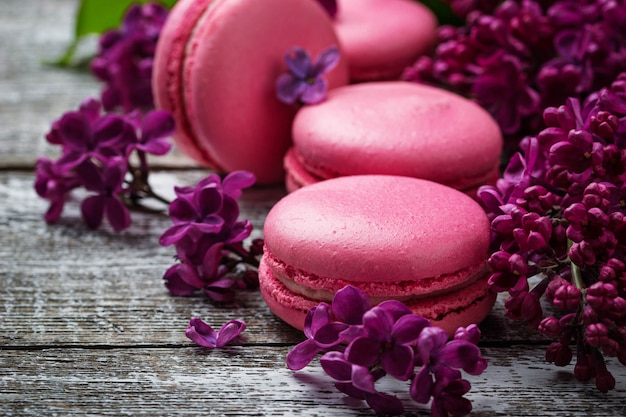 Premium Photo | Pink macaroons and lilac.