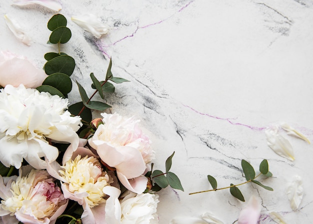 Premium Photo Pink Peonies On A Marble Background