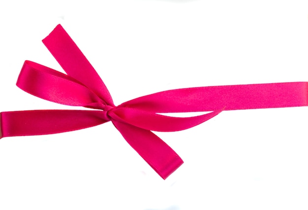 Premium Photo | Pink ribbon with bow isolated