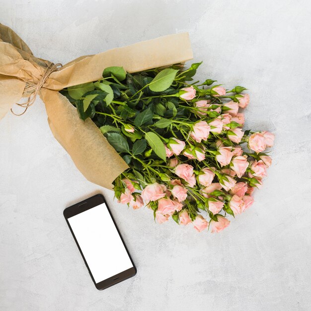 flowers wrapped in brown paper